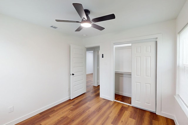 6840 Hillmont Dr, Dallas, TX 75217 - unfurnished bedroom with visible vents, light wood-style flooring, a closet, and baseboards