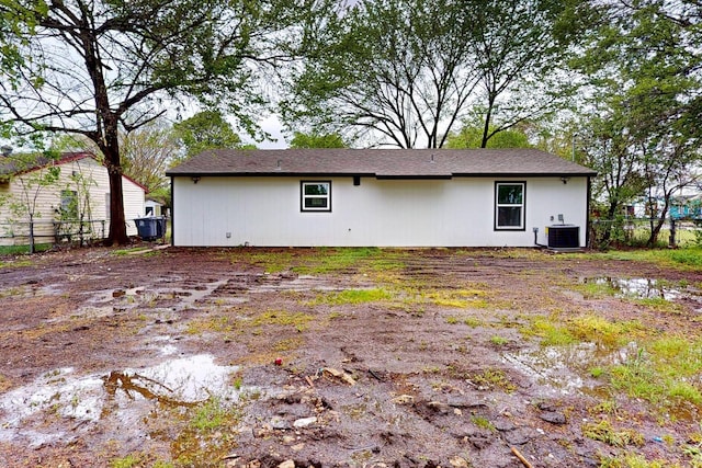 6840 Hillmont Dr, Dallas, TX 75217 - rear view of property featuring fence and central air condition unit