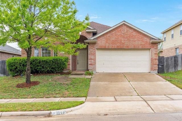 5013 Royal Burgess Dr, Fort Worth, TX 76135 - view of front of property featuring an attached garage, driveway, fence, and brick siding