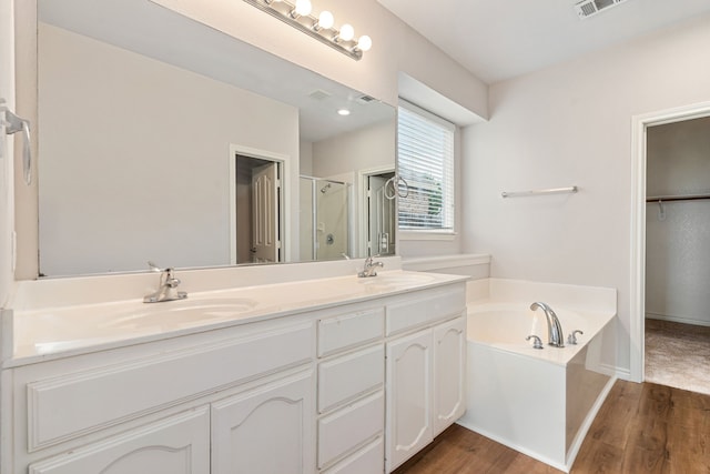 5013 Royal Burgess Dr, Fort Worth, TX 76135 - full bath with a garden tub, wood finished floors, a sink, and a shower stall