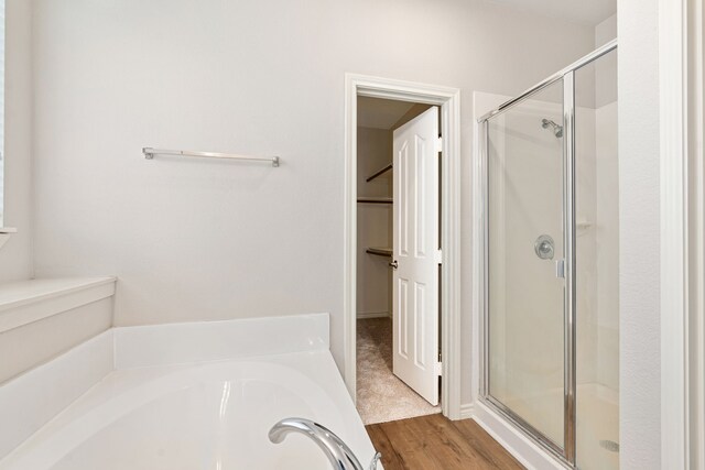 5013 Royal Burgess Dr, Fort Worth, TX 76135 - full bath with a bath, wood finished floors, and a stall shower