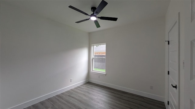 5629 Lester Granger, Fort Worth, TX 76112 - unfurnished bedroom with dark wood-style flooring, baseboards, and a ceiling fan