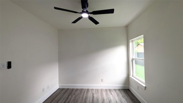 5629 Lester Granger, Fort Worth, TX 76112 - empty room featuring plenty of natural light, a ceiling fan, dark wood-style flooring, and baseboards