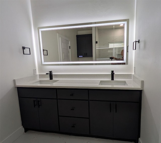 5629 Lester Granger, Fort Worth, TX 76112 - full bath with double vanity, baseboards, and marble look tiles