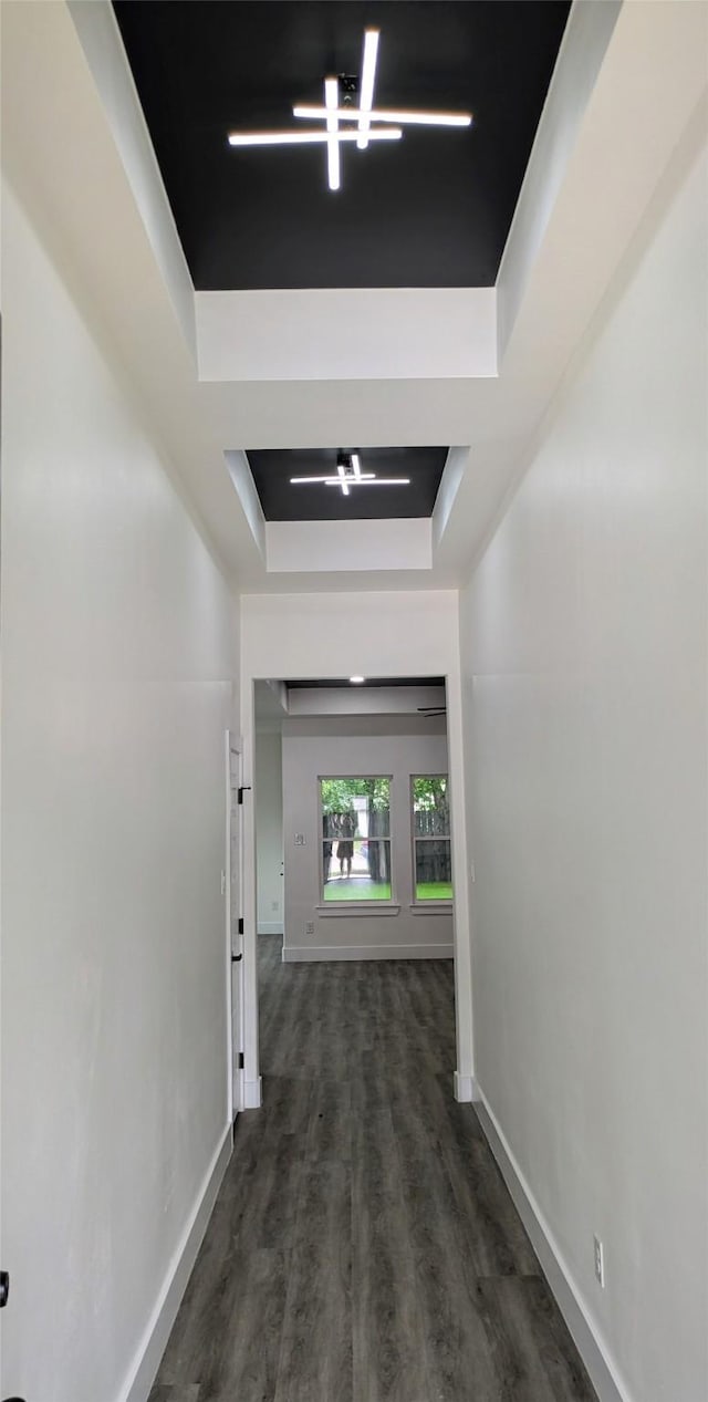 5629 Lester Granger, Fort Worth, TX 76112 - hall featuring a raised ceiling, baseboards, and dark wood-style floors
