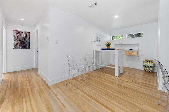 interior space featuring recessed lighting, visible vents, light wood-type flooring, and baseboards