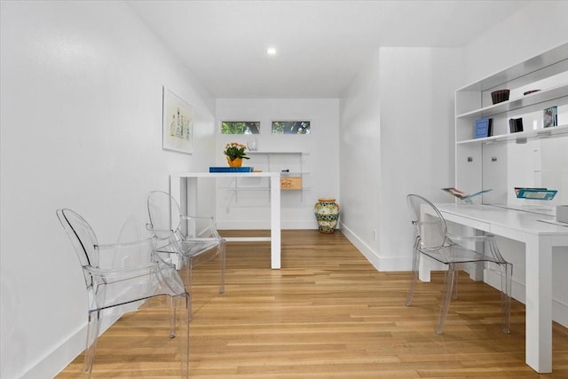 office with baseboards, light wood-type flooring, and recessed lighting