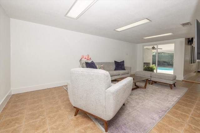 3848 S Drive, Fort Worth, TX 76109 - living room with light tile patterned floors, baseboards, and ceiling fan