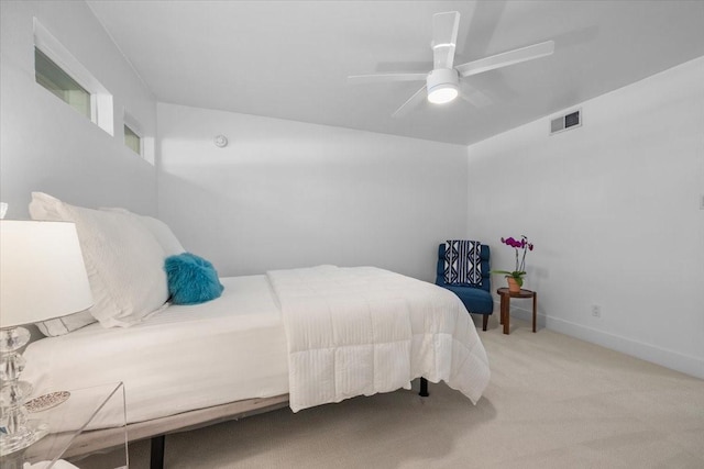 bedroom with baseboards, a ceiling fan, visible vents, and carpet floors