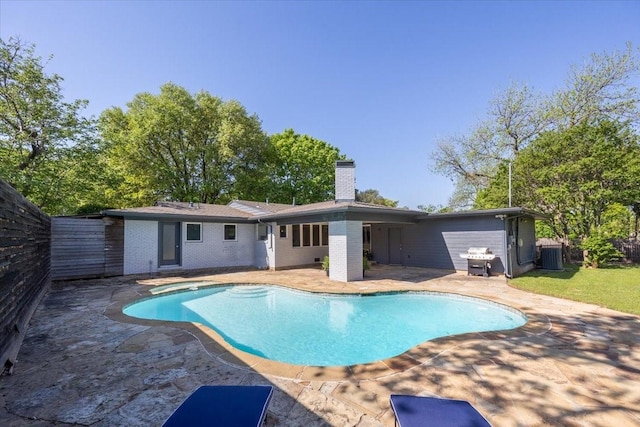 pool featuring a patio and central AC unit