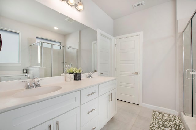 3908 Rochelle St, Celina, TX 75009 - bathroom with a shower stall, double vanity, and tile patterned flooring