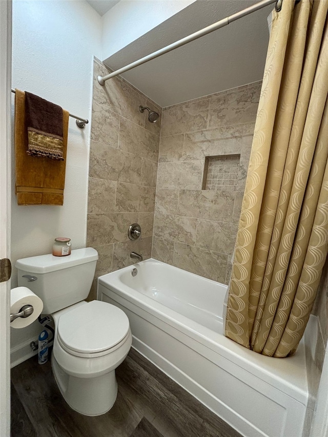 13633 Weald Green St, Dallas, TX 75240 - bathroom with shower / bath combination with curtain, wood finished floors, and toilet