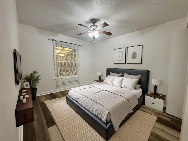 13633 Weald Green St, Dallas, TX 75240 - bedroom with wood finished floors, baseboards, and ceiling fan