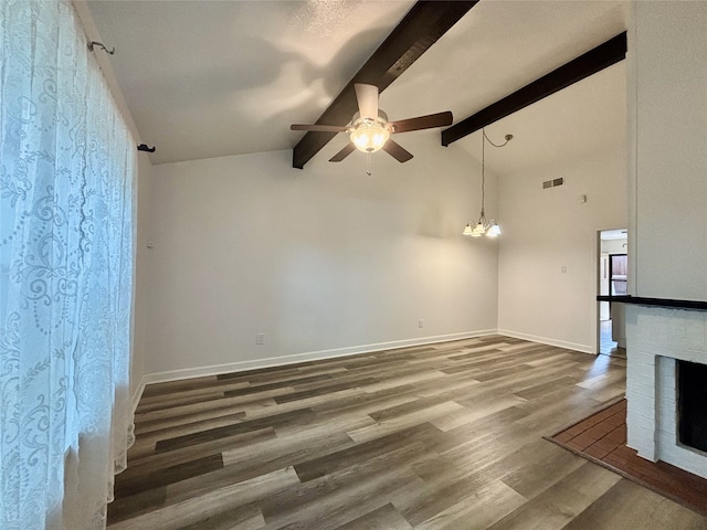 13633 Weald Green St, Dallas, TX 75240 - unfurnished room with ceiling fan, wood finished floors, baseboards, a fireplace, and a chandelier