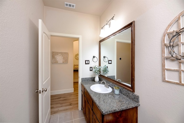 1664 Laramie Ln, Burleson, TX 76028 - bathroom featuring tile patterned floors, vanity, visible vents, and baseboards