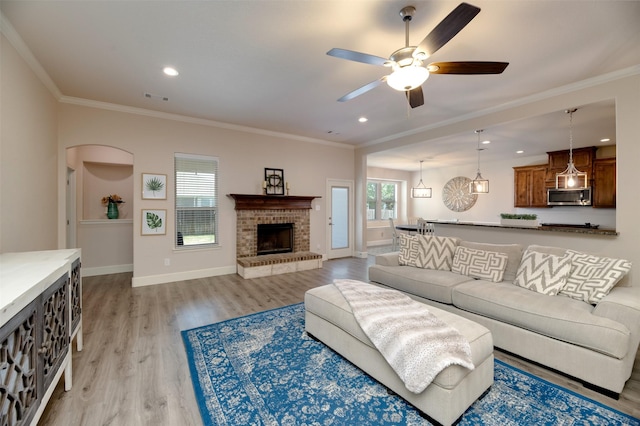 1664 Laramie Ln, Burleson, TX 76028 - living room with ornamental molding, a ceiling fan, visible vents, light wood finished floors, and baseboards
