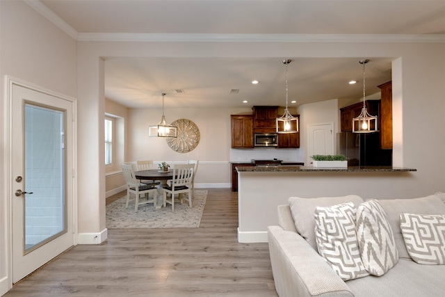 1664 Laramie Ln, Burleson, TX 76028 - living room with baseboards, an inviting chandelier, recessed lighting, light wood-style flooring, and crown molding