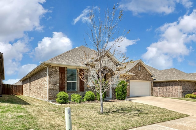 1664 Laramie Ln, Burleson, TX 76028 - french provincial home featuring a front yard, an attached garage, fence, brick siding, and driveway