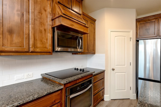 1664 Laramie Ln, Burleson, TX 76028 - kitchen with tasteful backsplash, dark stone counters, and appliances with stainless steel finishes