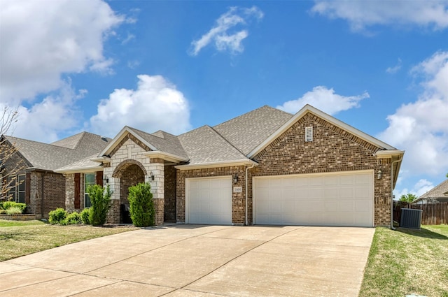1664 Laramie Ln, Burleson, TX 76028 - view of front of property featuring an attached garage, concrete driveway, fence, and brick siding