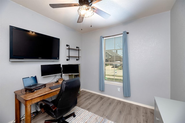 1664 Laramie Ln, Burleson, TX 76028 - home office with light wood-style floors, baseboards, and a ceiling fan