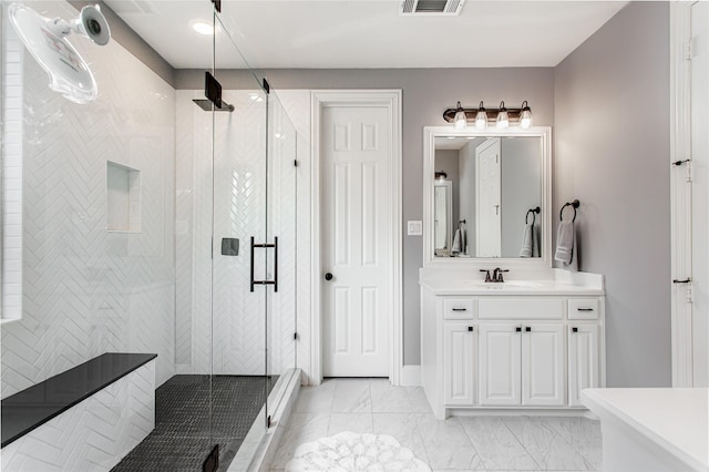 bathroom with visible vents, marble finish floor, vanity, and a stall shower