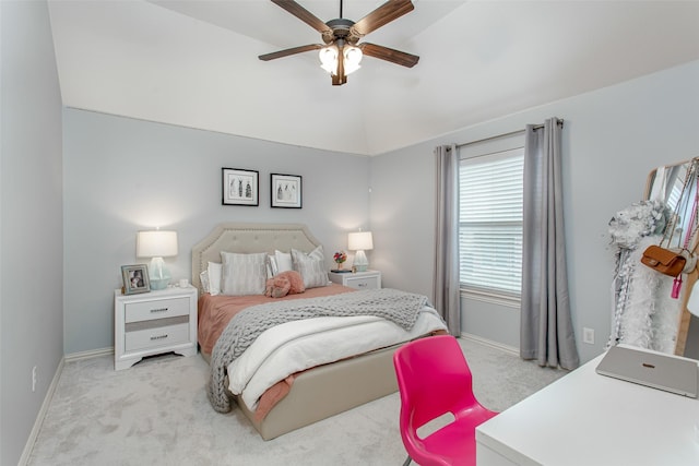 carpeted bedroom featuring vaulted ceiling, baseboards, and ceiling fan