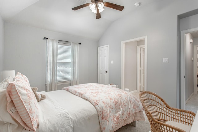 bedroom with lofted ceiling, light carpet, baseboards, and ceiling fan