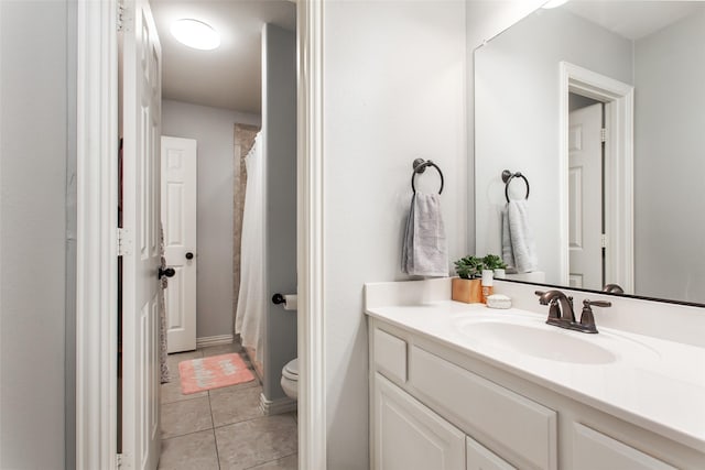 bathroom featuring a shower with curtain, tile patterned flooring, vanity, and toilet