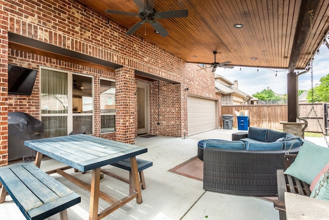 view of patio / terrace featuring outdoor lounge area, a grill, fence, a garage, and ceiling fan