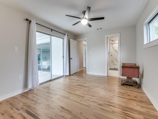 3124 Merrell Rd, Dallas, TX 75229 - unfurnished living room featuring light wood-style flooring, baseboards, and ceiling fan