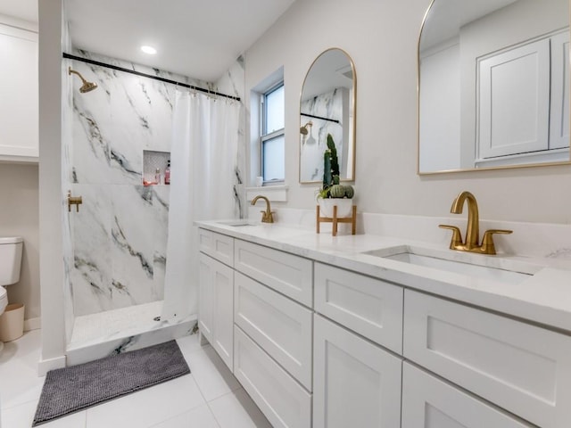 3124 Merrell Rd, Dallas, TX 75229 - full bath with toilet, a marble finish shower, double vanity, tile patterned flooring, and recessed lighting