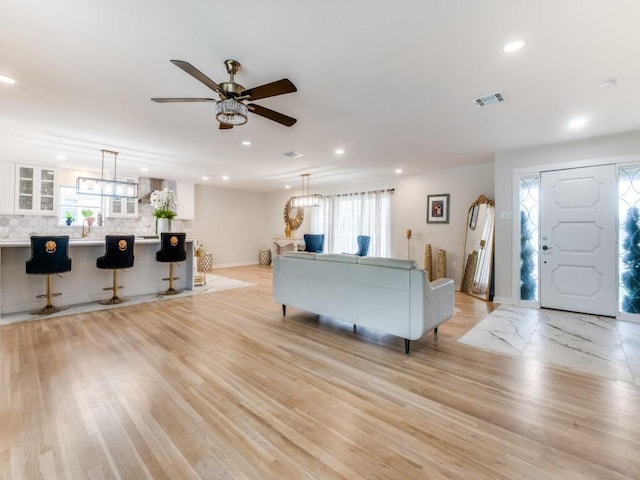 3124 Merrell Rd, Dallas, TX 75229 - living area featuring ceiling fan, recessed lighting, and light wood-style flooring