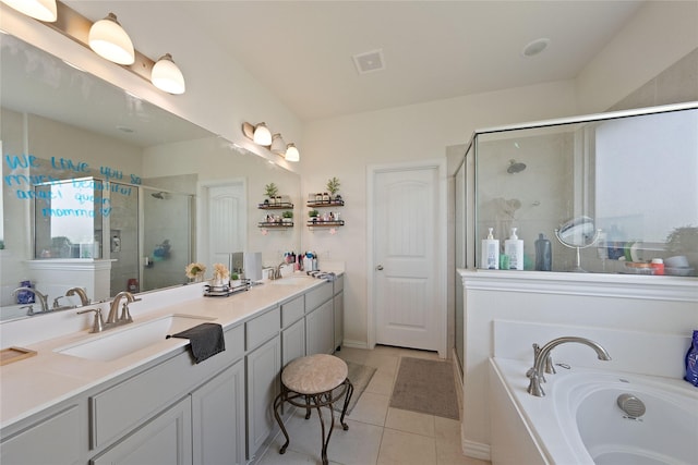 5017 Freestone Dr, Weatherford, TX 76085 - bathroom with a bath, tile patterned floors, a sink, double vanity, and a shower stall