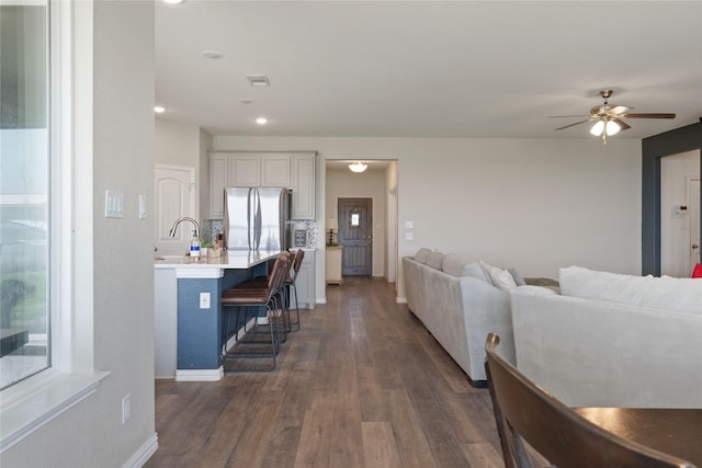 5017 Freestone Dr, Weatherford, TX 76085 - living area with dark wood finished floors, baseboards, ceiling fan, and recessed lighting