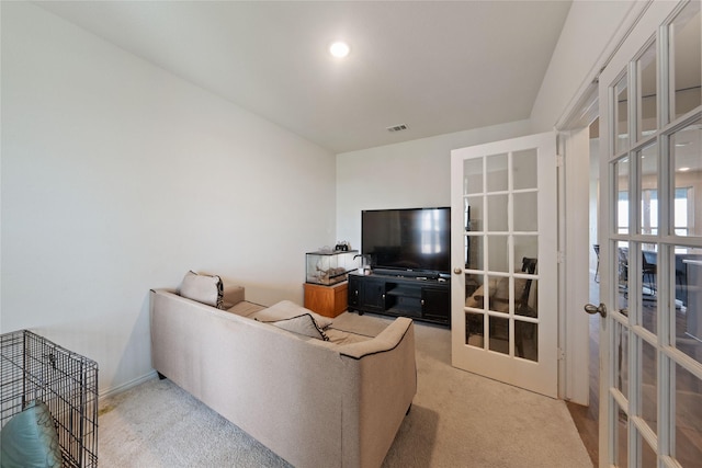 5017 Freestone Dr, Weatherford, TX 76085 - living room with visible vents, light colored carpet, and french doors