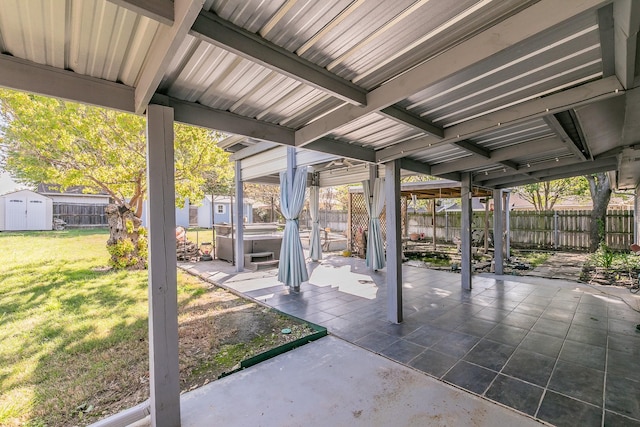 7820 Prairie Dr, Watauga, TX 76148 - view of patio featuring a storage unit, a hot tub, and an outdoor structure