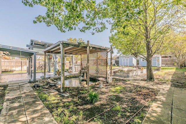 7820 Prairie Dr, Watauga, TX 76148 - fenced backyard with a storage unit, a patio area, and an outdoor structure