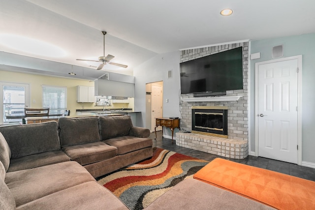7820 Prairie Dr, Watauga, TX 76148 - living area with vaulted ceiling, ceiling fan, a fireplace, and baseboards