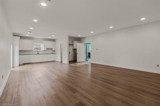 3846 County Road 2617, Caddo Mills, TX 75135 - unfurnished living room featuring wood finished floors, baseboards, and recessed lighting