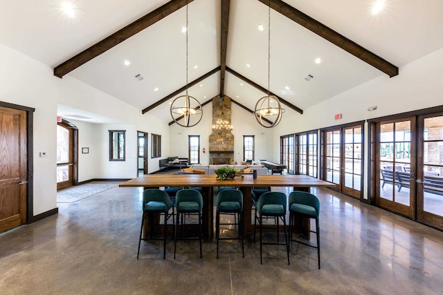 11328 Cider St, Fort Worth, TX 76052 - dining area with beam ceiling, concrete flooring, a healthy amount of sunlight, and high vaulted ceiling