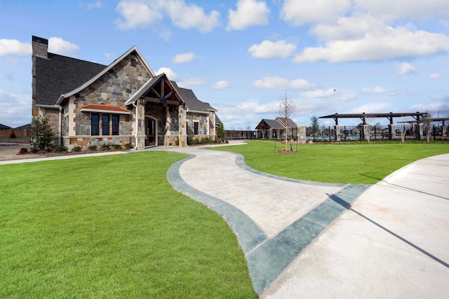 11328 Cider St, Fort Worth, TX 76052 - view of front facade featuring stone siding, a front lawn, a chimney, and a shingled roof