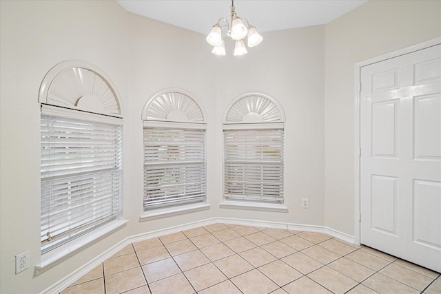 12072 Half Hitch Trl, Frisco, TX 75035 - unfurnished dining area featuring an inviting chandelier, baseboards, and light tile patterned floors