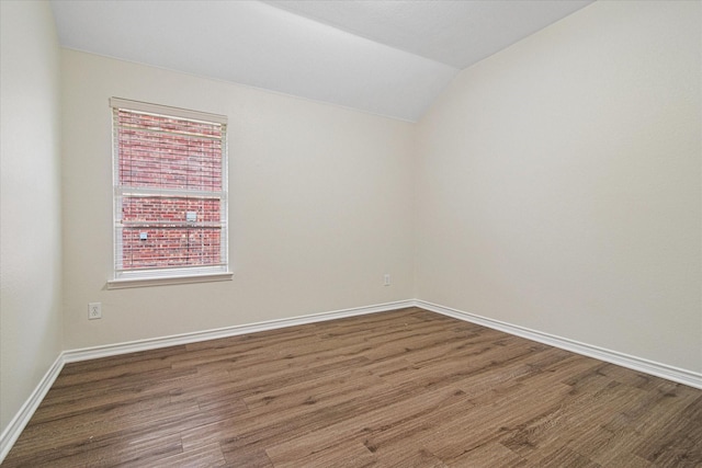12072 Half Hitch Trl, Frisco, TX 75035 - unfurnished room with wood finished floors, baseboards, and lofted ceiling