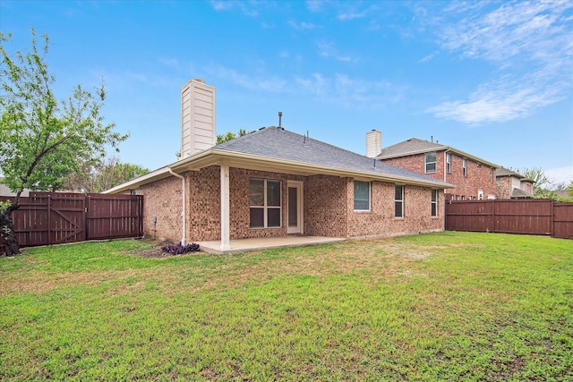 12072 Half Hitch Trl, Frisco, TX 75035 - back of house with a patio, a chimney, a fenced backyard, and brick siding