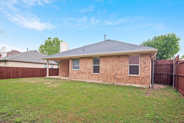 12072 Half Hitch Trl, Frisco, TX 75035 - rear view of house with a yard, a chimney, a fenced backyard, a patio, and brick siding