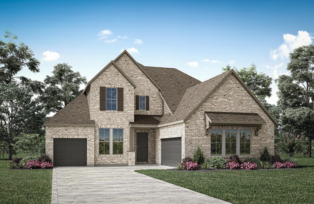1570 Binkley, Prosper, TX 75078 - view of front facade featuring brick siding, an attached garage, and driveway