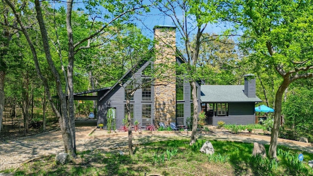 rear view of house with a chimney
