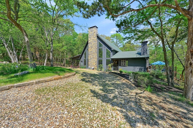 back of property featuring a chimney