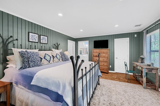 bedroom featuring visible vents, recessed lighting, and wood finished floors